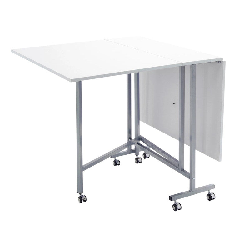 Table pliante artisanale et de coupe blanche/argentée à roulettes, 1 personne