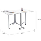 Table pliante artisanale et de coupe blanche/argentée à roulettes, 1 personne